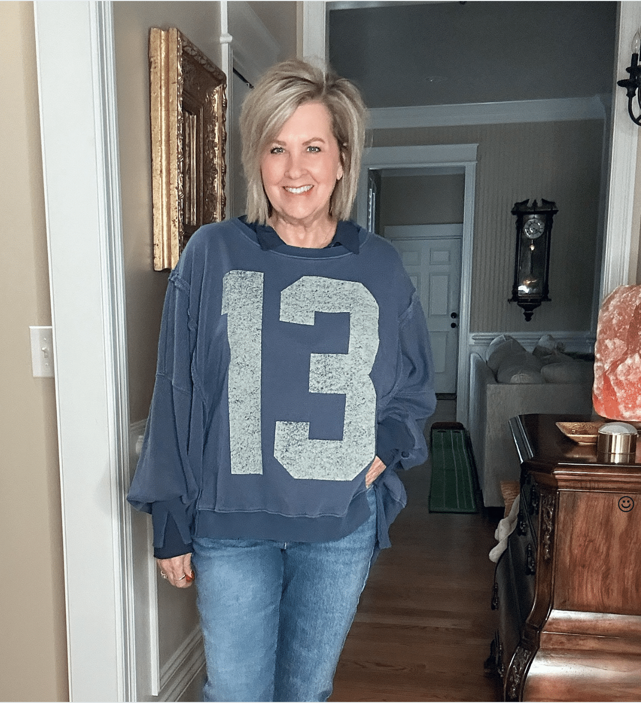 Over 50 Fashion Blogger, Tania Stephens, wearing a #13 blue sweatshirt 